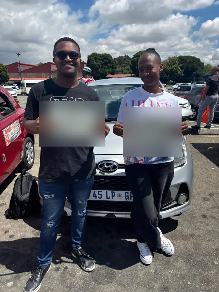 Two learners celebrating after passing